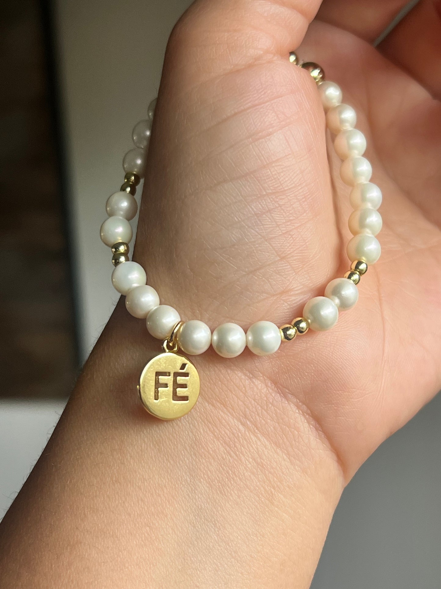 Fe