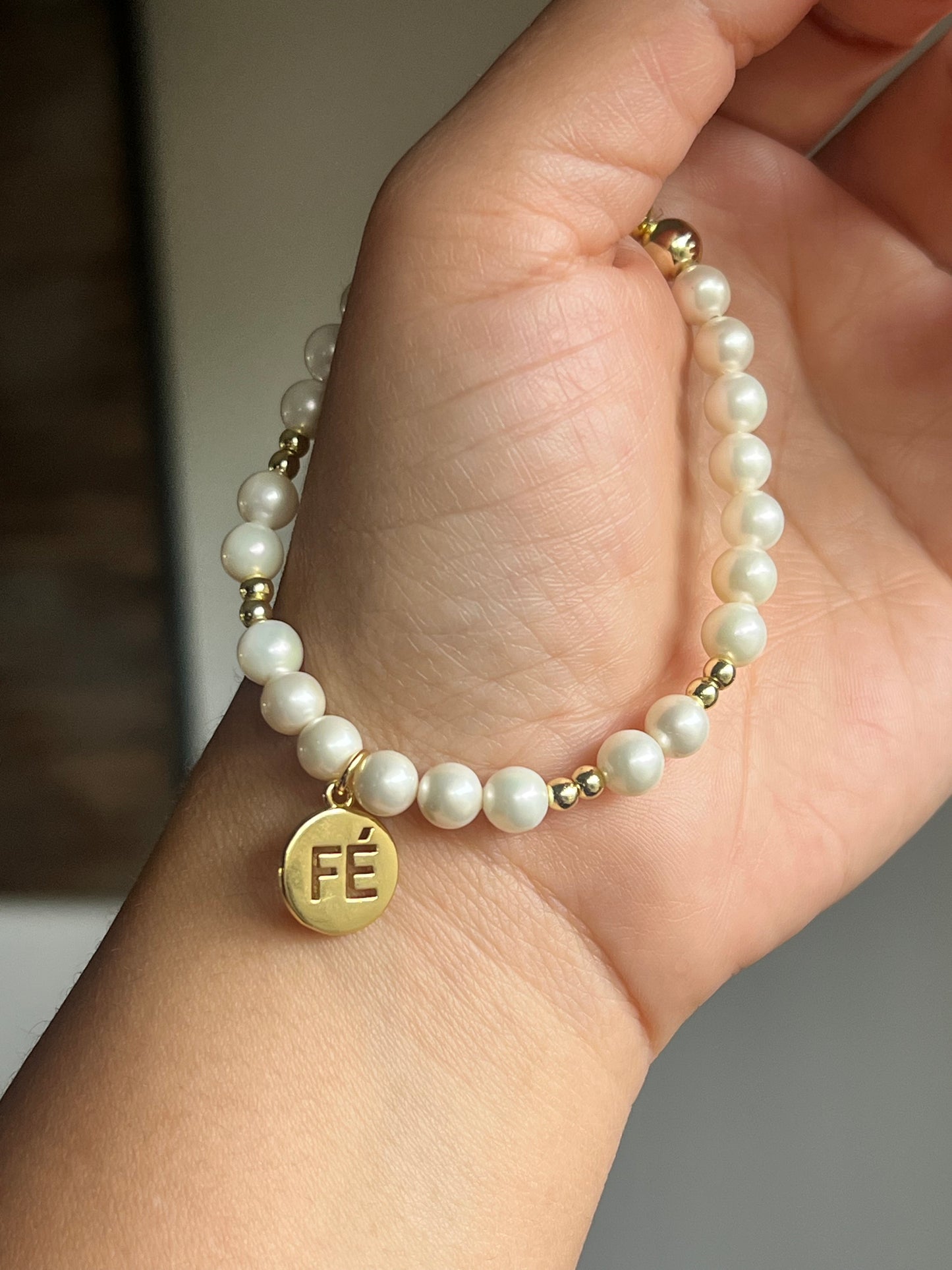 Fe